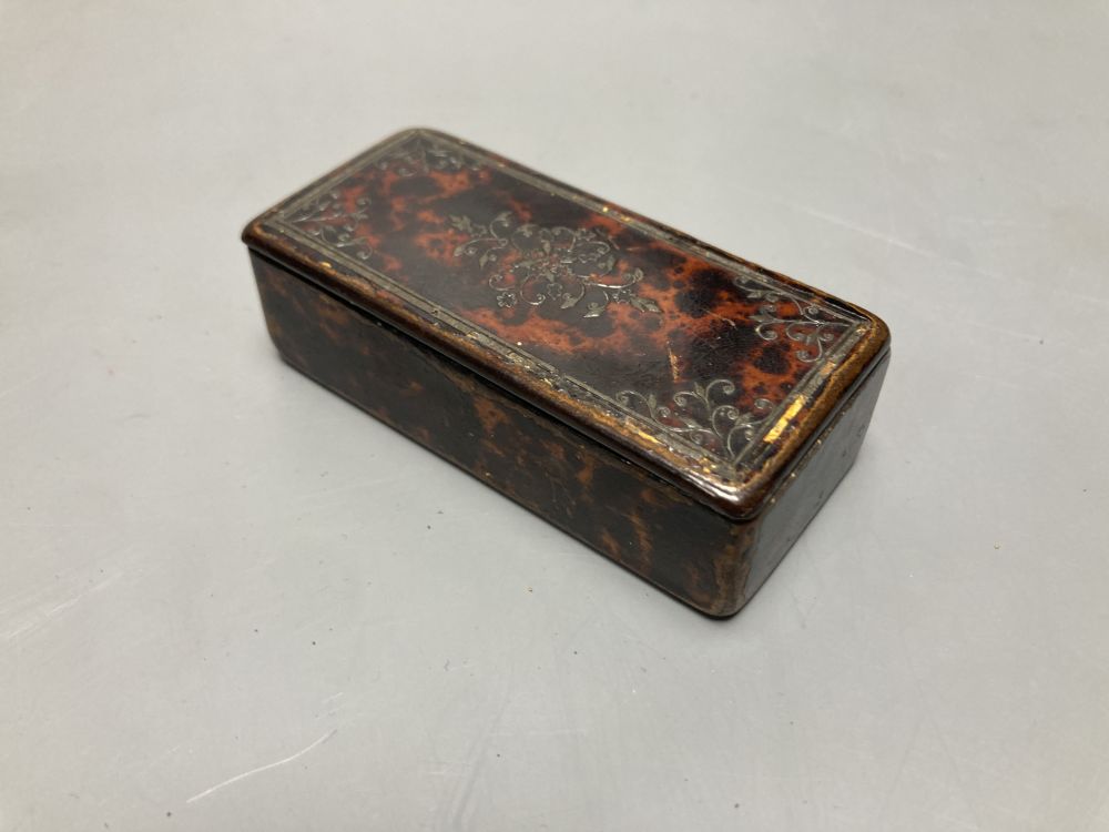 A 19th century papier mache faux tortoiseshell snuff box and a tortoiseshell case containing lace bobbin and needles